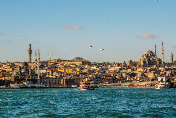 city in Turkey with water in foreground and buildings on horizon